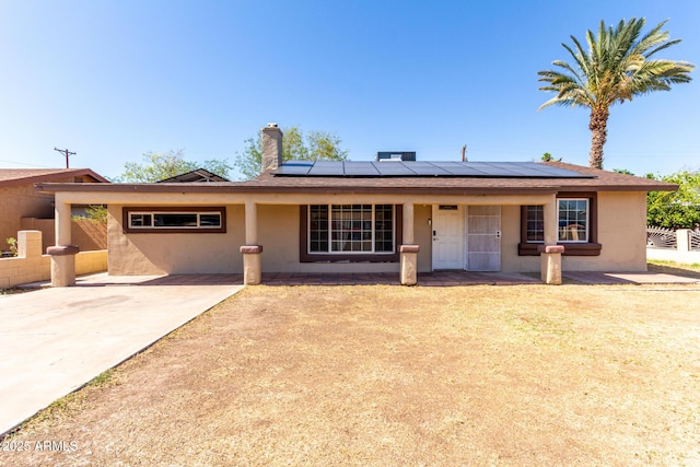 2064 W 2nd St, Mesa, AZ 85201 - single story home with stucco siding, a porch, and solar panels
