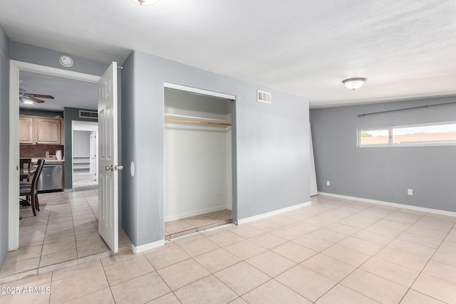 2064 W 2nd St, Mesa, AZ 85201 - unfurnished bedroom featuring light tile patterned floors, baseboards, and a closet
