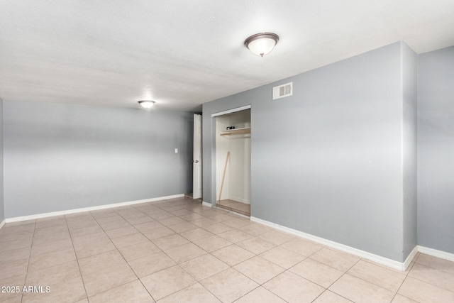 2064 W 2nd St, Mesa, AZ 85201 - spare room with light tile patterned floors and baseboards