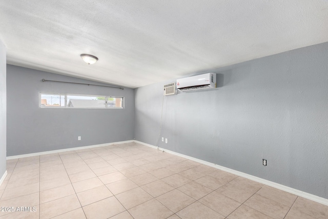2064 W 2nd St, Mesa, AZ 85201 - unfurnished room featuring a wall mounted air conditioner, a textured ceiling, and baseboards