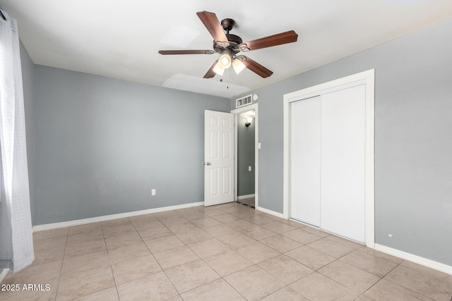 2064 W 2nd St, Mesa, AZ 85201 - unfurnished bedroom featuring light tile patterned floors, a closet, baseboards, and ceiling fan