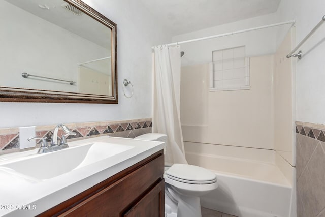 2064 W 2nd St, Mesa, AZ 85201 - full bath with tile walls, vanity, shower / bath combo, toilet, and wainscoting