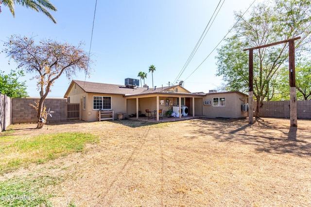 2064 W 2nd St, Mesa, AZ 85201 - back of house with stucco siding, a fenced backyard, and a patio