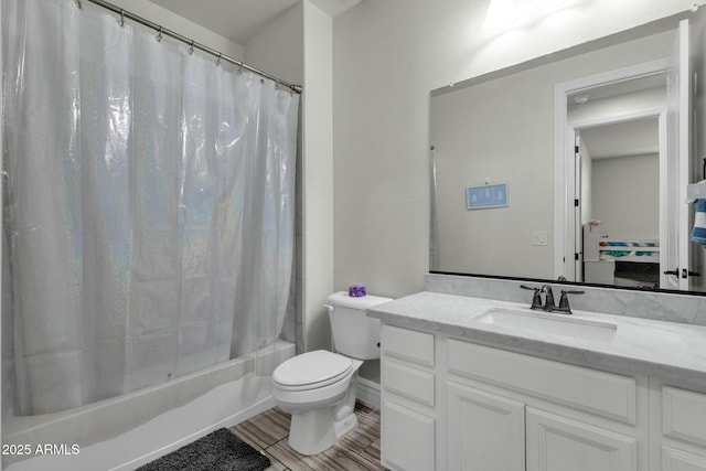 bathroom featuring vanity, toilet, and shower / bath combo