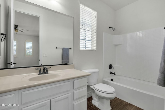 full bath featuring ceiling fan, toilet, wood finished floors, and plenty of natural light