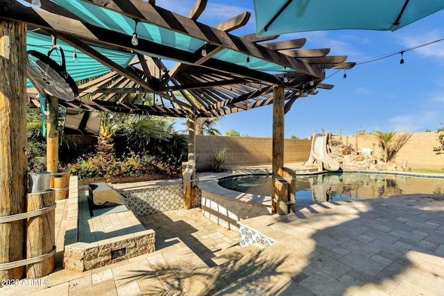 view of patio / terrace featuring a pergola, a fenced in pool, a fenced backyard, and a jacuzzi