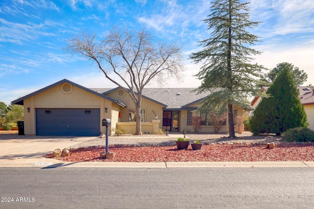 single story home with a garage