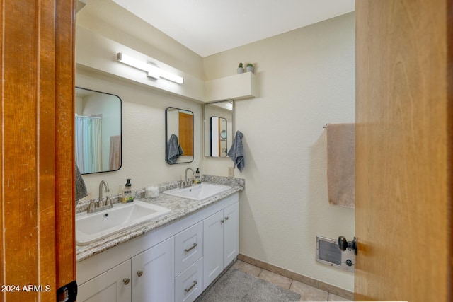 bathroom featuring tile patterned floors and vanity