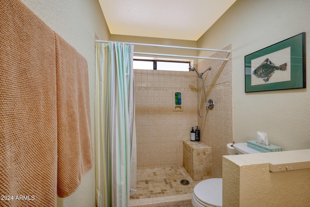 bathroom with toilet and walk in shower