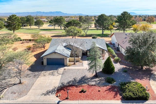 birds eye view of property with a mountain view