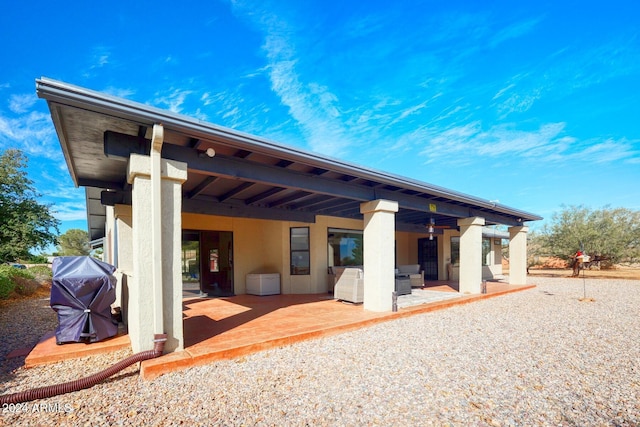 back of property featuring a patio area