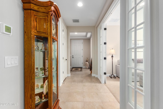 hallway with light tile patterned flooring