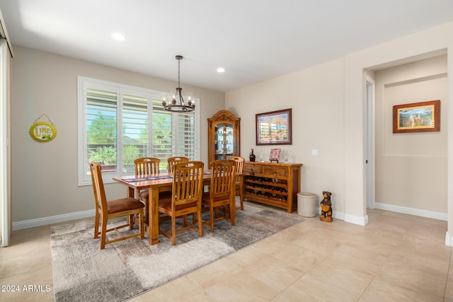 dining space featuring a chandelier