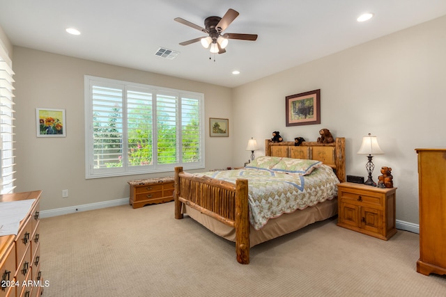 bedroom featuring ceiling fan and light colored carpet