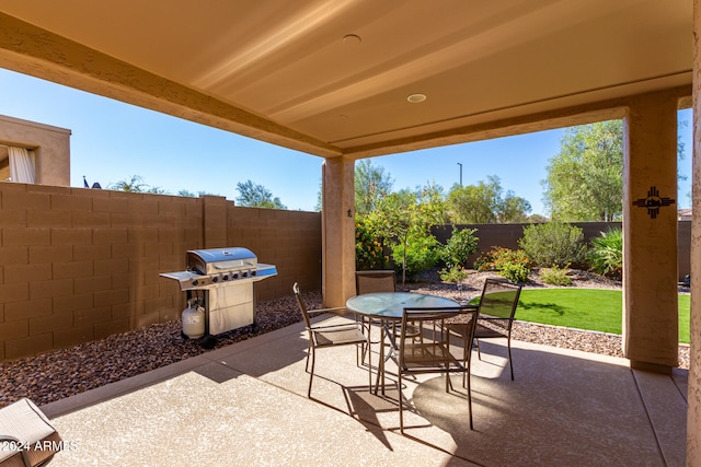 view of patio featuring a grill