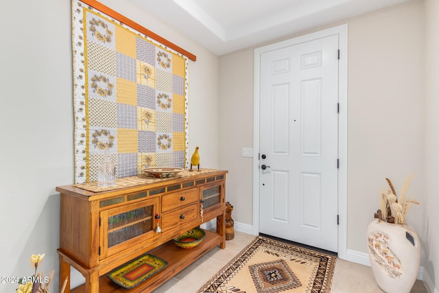 foyer entrance with light tile patterned flooring