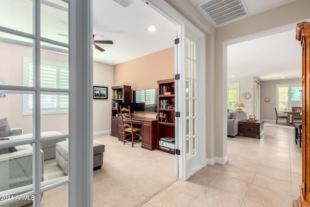 office area featuring light tile patterned floors and ceiling fan