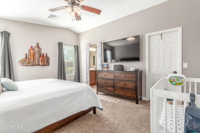 carpeted bedroom featuring lofted ceiling and ceiling fan