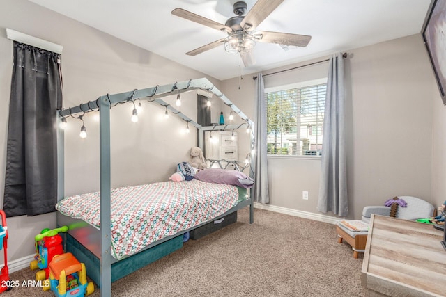 bedroom with ceiling fan and carpet flooring