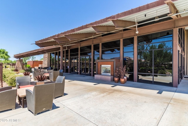 view of patio with a tiled fireplace