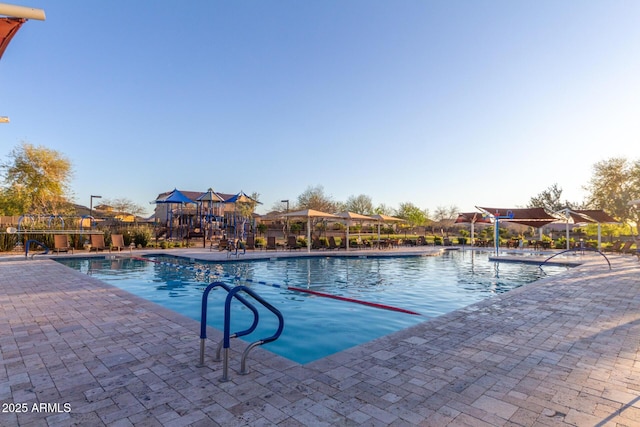 view of swimming pool with a patio area