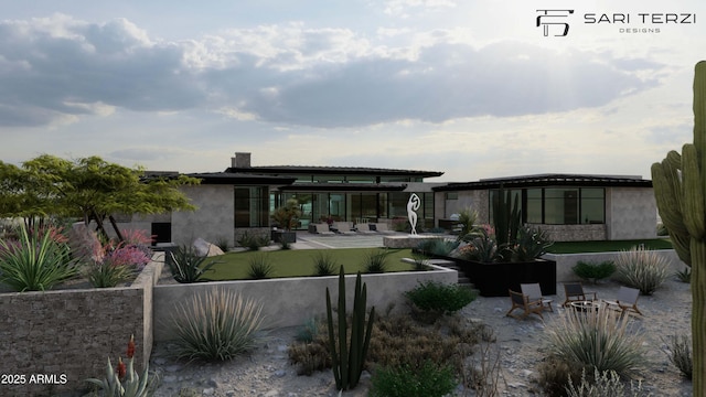 rear view of house featuring a patio area, stucco siding, and fence