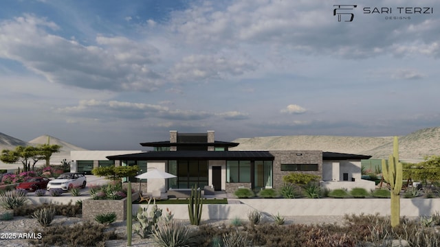 rear view of property with a mountain view