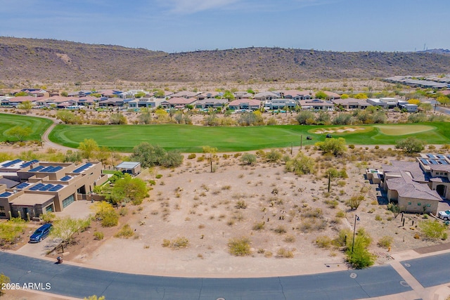bird's eye view featuring a mountain view, golf course view, and a residential view
