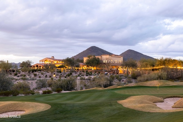 surrounding community featuring a mountain view and view of golf course