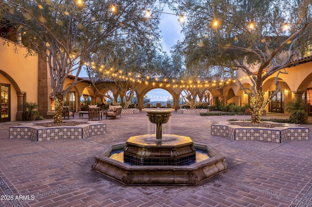 view of community featuring an outdoor living space and a patio