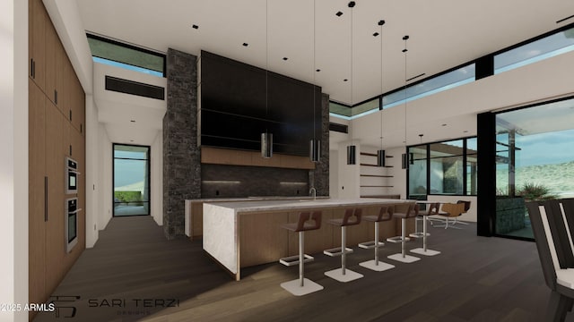 kitchen featuring a high ceiling, light countertops, dark wood-type flooring, modern cabinets, and dark cabinetry