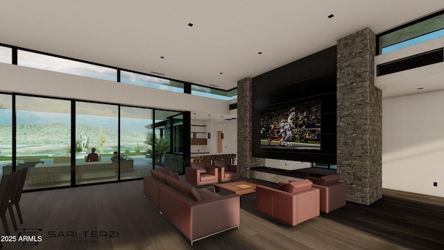 cinema room featuring a high ceiling and wood finished floors