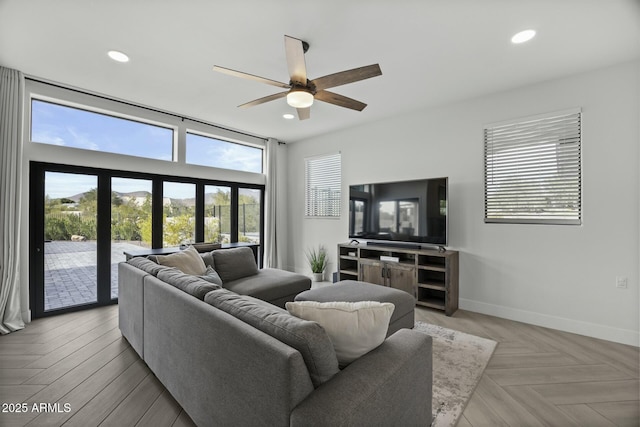 living room with ceiling fan, light parquet floors, and french doors