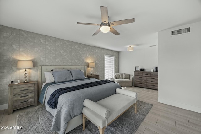 bedroom featuring light wood-type flooring and ceiling fan