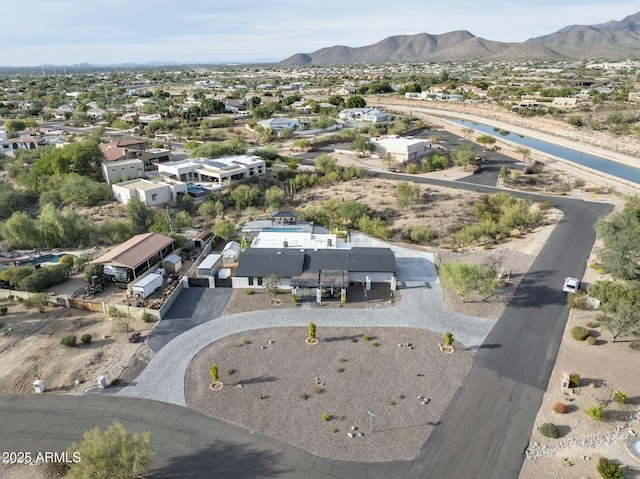 birds eye view of property with a mountain view