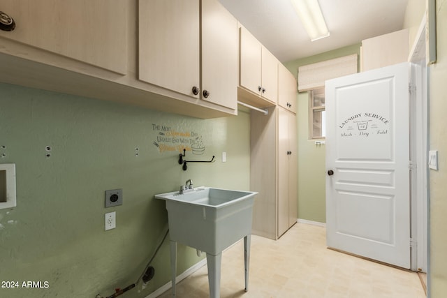 laundry area with cabinets and hookup for an electric dryer