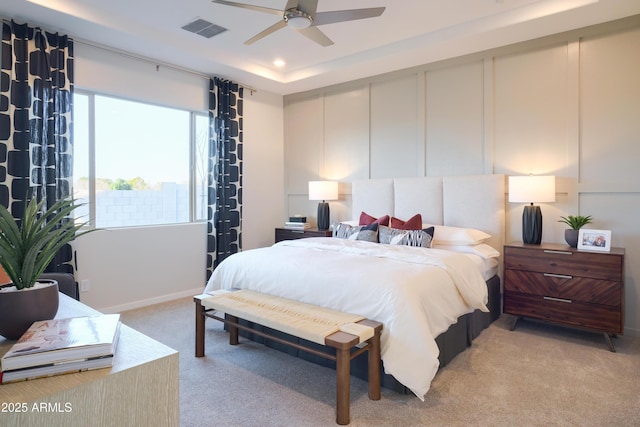 bedroom featuring light colored carpet and ceiling fan