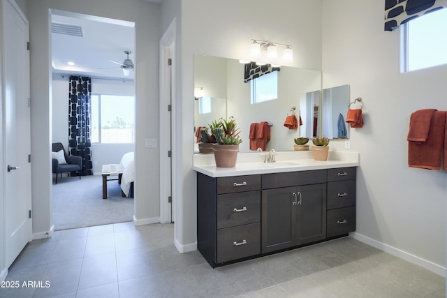 bathroom with ceiling fan, vanity, and tile patterned floors