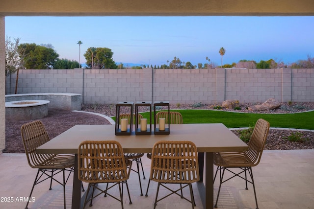 view of patio featuring a fire pit