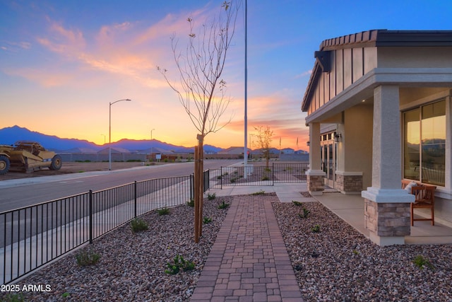 yard at dusk with a mountain view