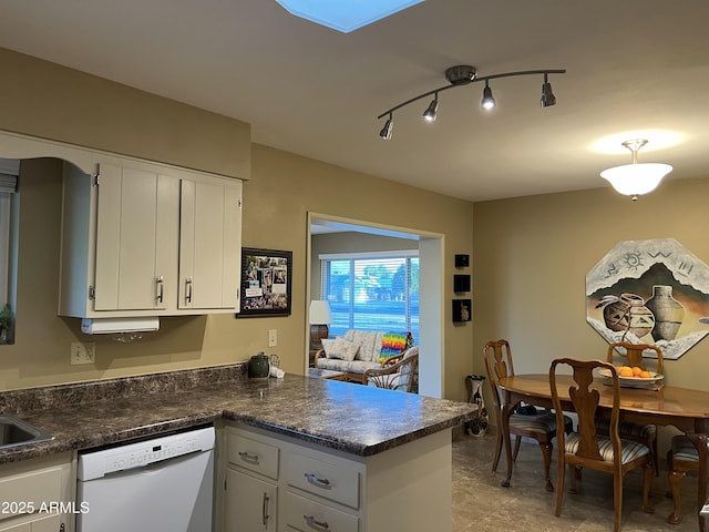 kitchen featuring white cabinetry, white dishwasher, and kitchen peninsula