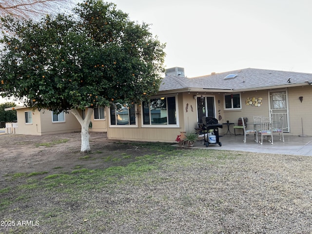 back of house with a patio area