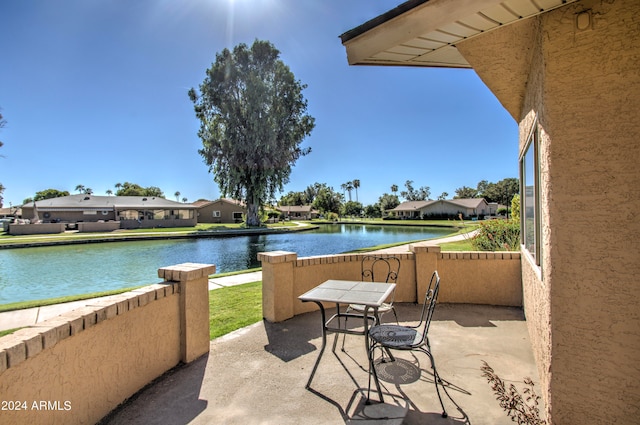 view of patio / terrace with a water view