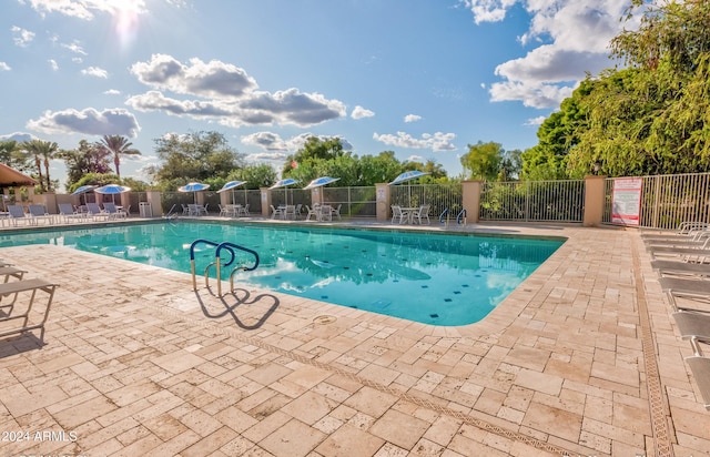 view of swimming pool featuring a patio area