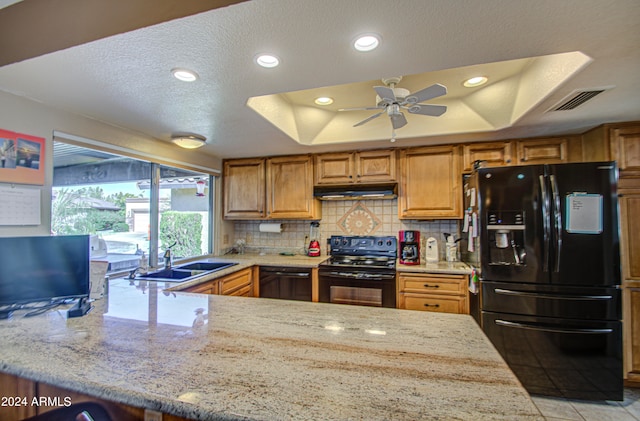 kitchen with black appliances, a textured ceiling, sink, kitchen peninsula, and ceiling fan