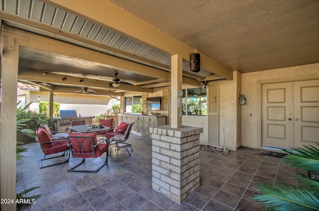 view of patio featuring ceiling fan