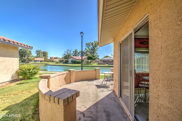 view of patio featuring a water view