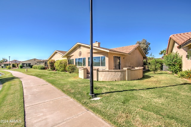 exterior space featuring a front lawn