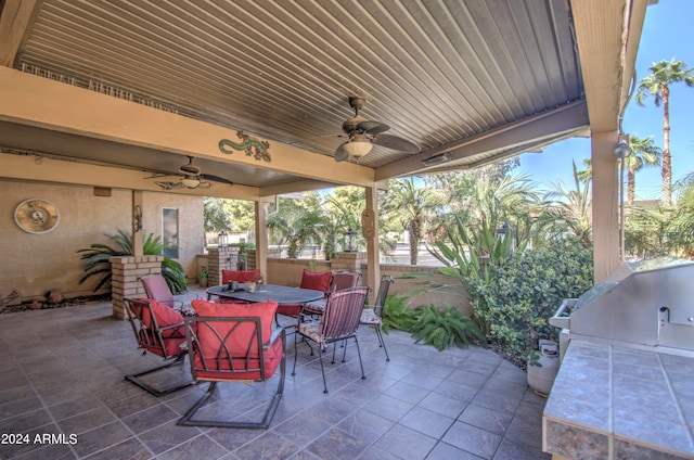 view of patio / terrace featuring area for grilling and ceiling fan