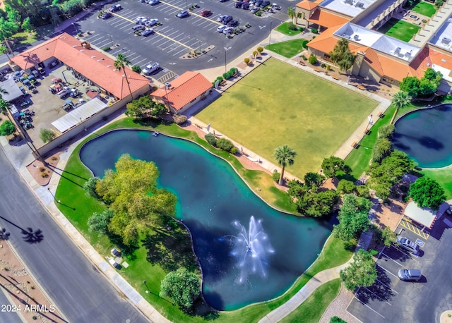 birds eye view of property with a water view